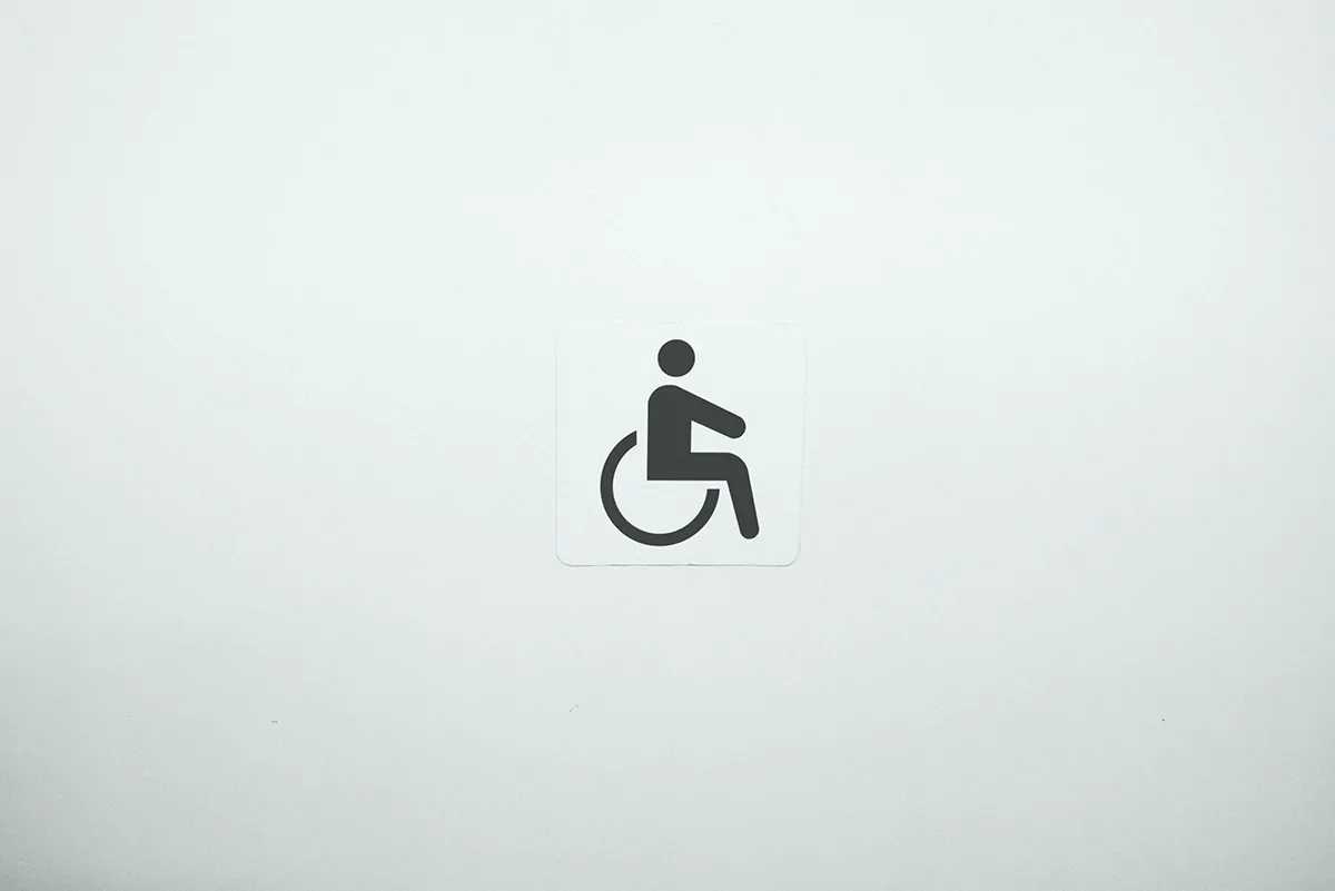 graphic of wheelchair user in the middle of a white square