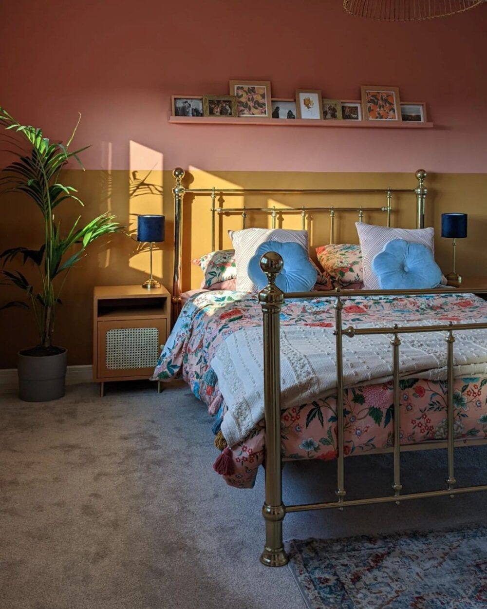 Pink and yellow bedroom with a metal bed